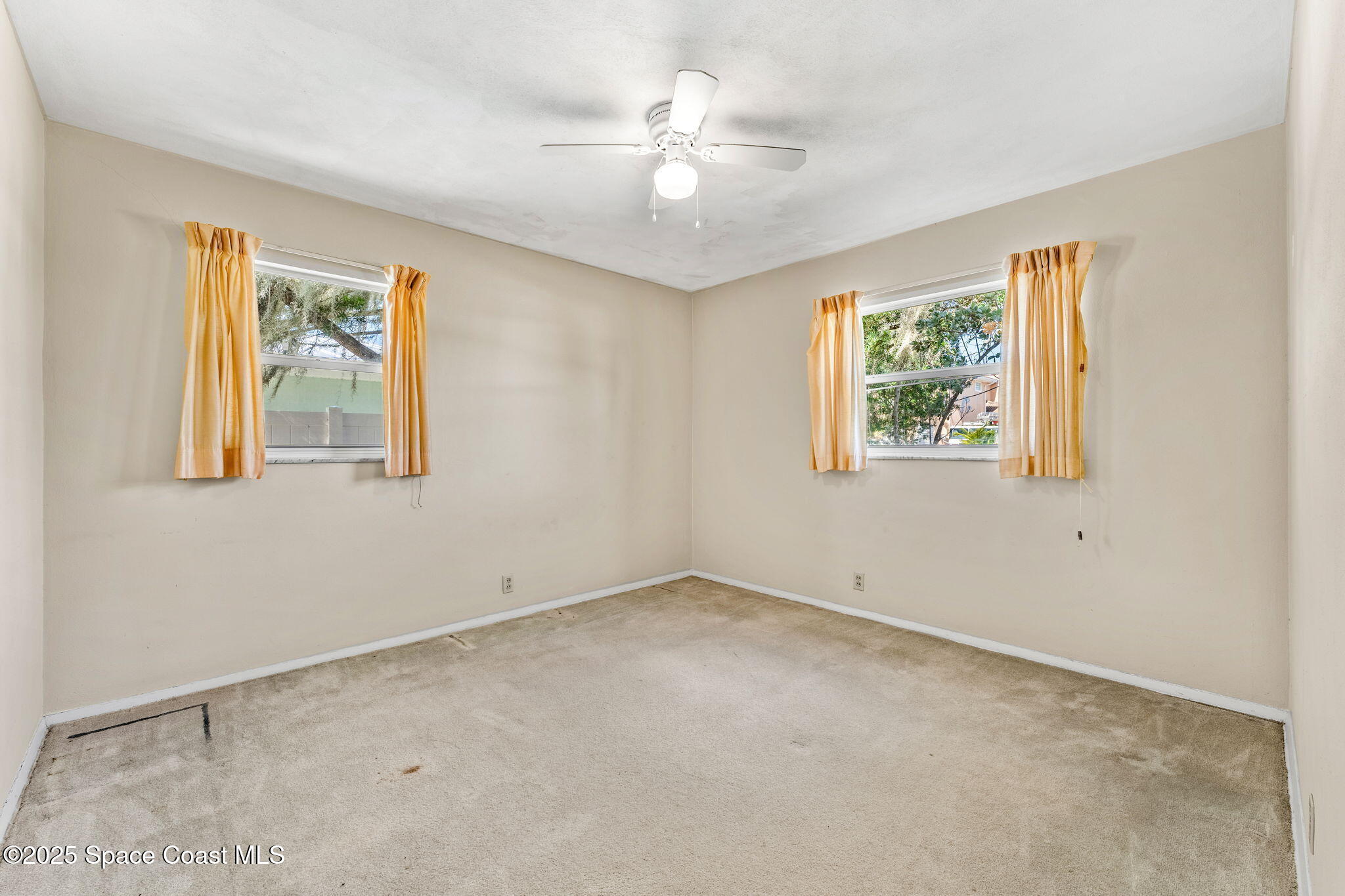 272 Bahama Boulevard Cocoa Beach, FL 32931 - Photo 32 of 63 a view of an empty room with a window