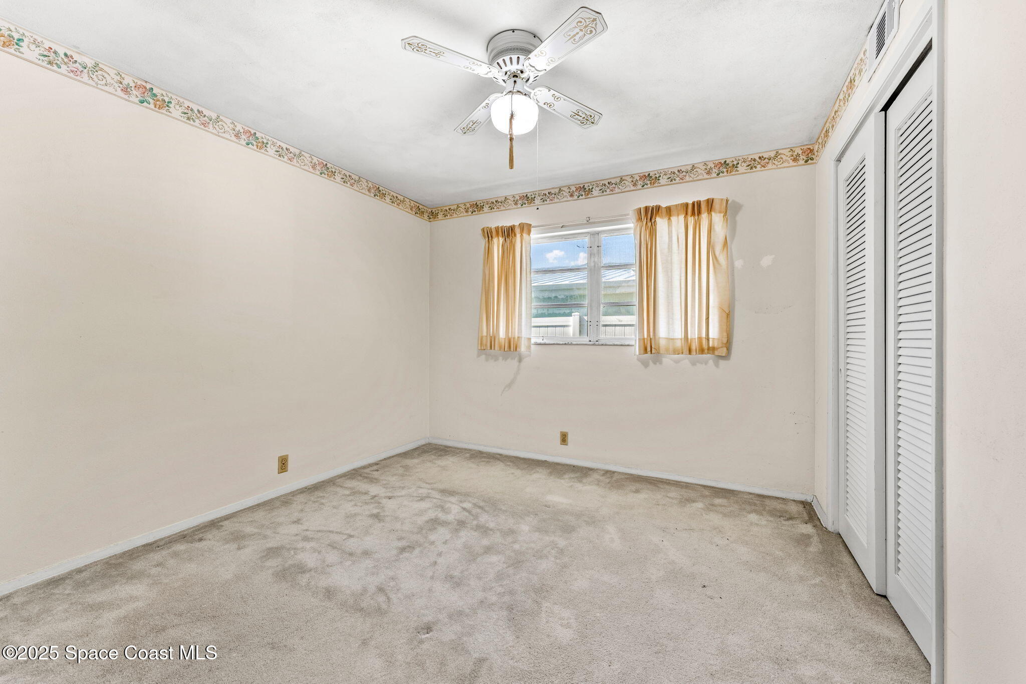 272 Bahama Boulevard Cocoa Beach, FL 32931 - Photo 33 of 63 a view of an empty room with a window