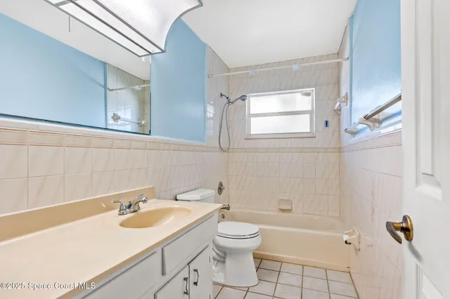 an aerial view of a houses with a lake view