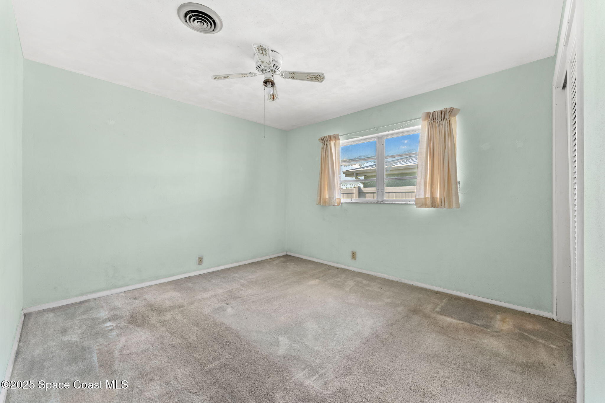 272 Bahama Boulevard Cocoa Beach, FL 32931 - Photo 35 of 63 an empty room with a window