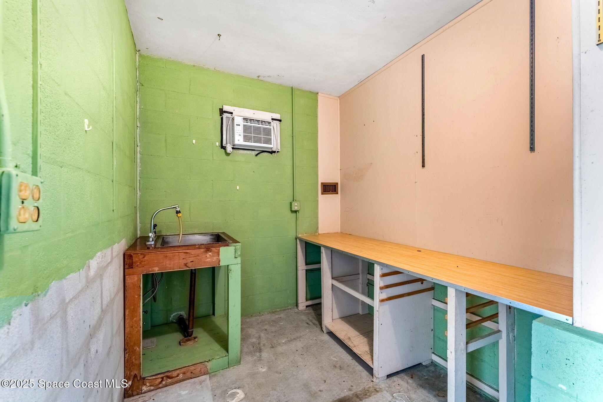 272 Bahama Boulevard Cocoa Beach, FL 32931 - Photo 36 of 63 a room with cabinets and a wooden floor