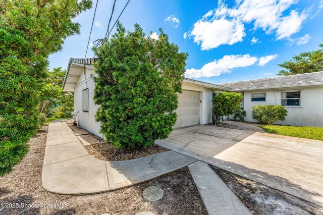 a view of a hallway view with wooden floor and windows