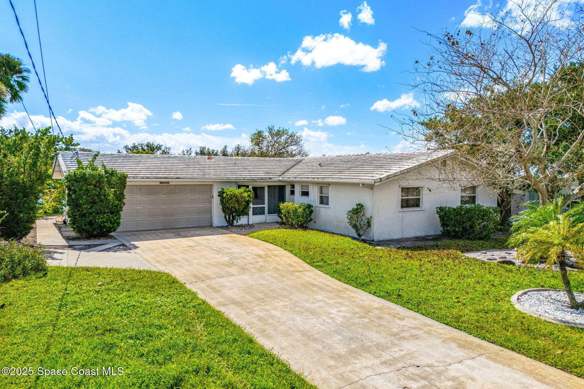 272 Bahama Boulevard Cocoa Beach, FL 32931 - Photo 45 of 63 a front view of a house with garden