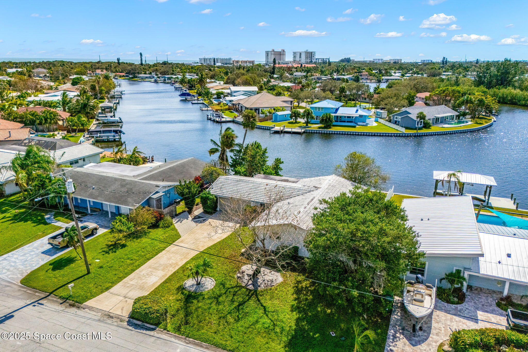 272 Bahama Boulevard Cocoa Beach, FL 32931 - Photo 48 of 63 an aerial view of a house with a lake view