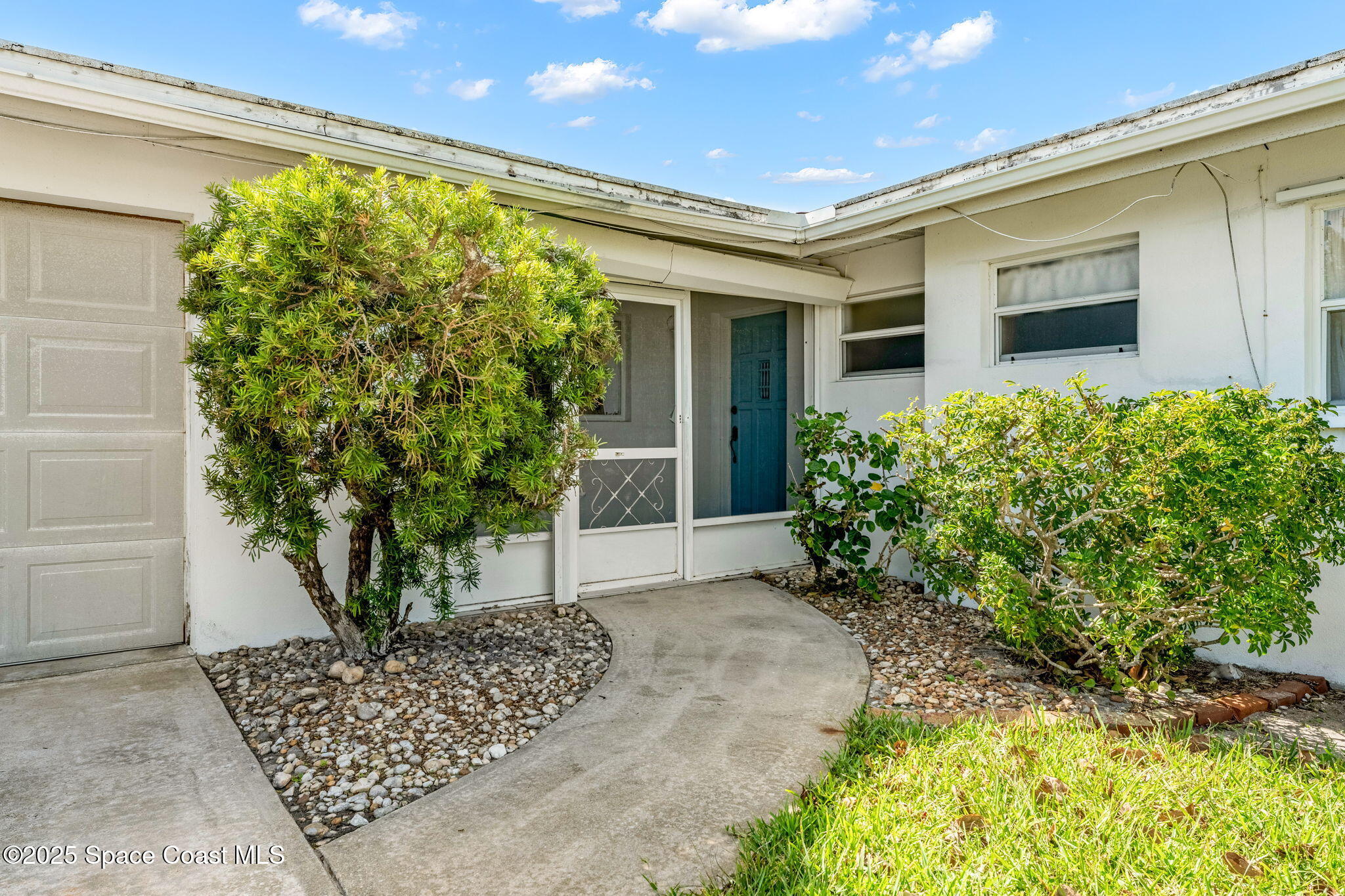 272 Bahama Boulevard Cocoa Beach, FL 32931 - Photo 5 of 63 a front view of a house with garden