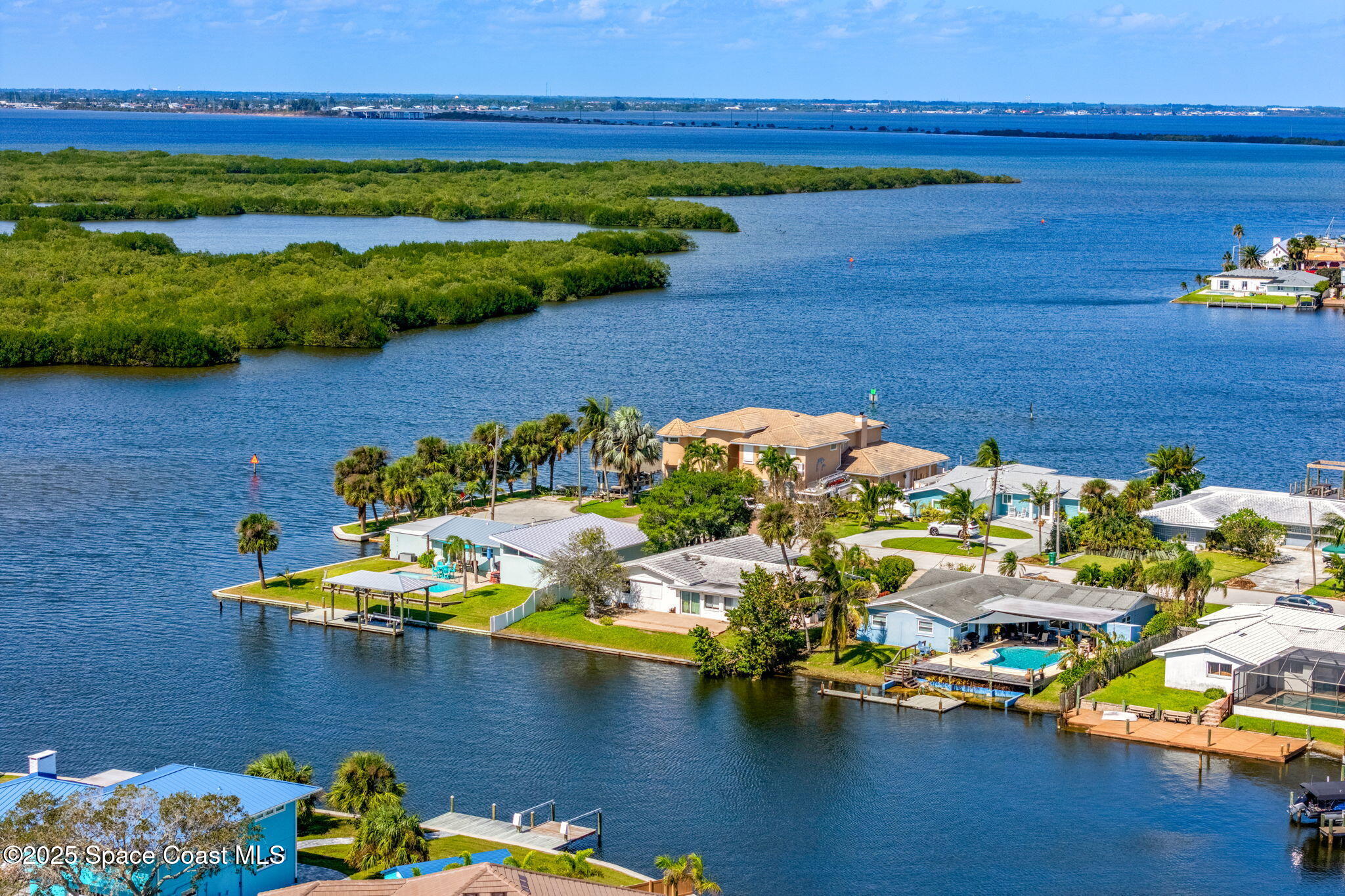 272 Bahama Boulevard Cocoa Beach, FL 32931 - Photo 61 of 63 a view of a lake with a nearby beach