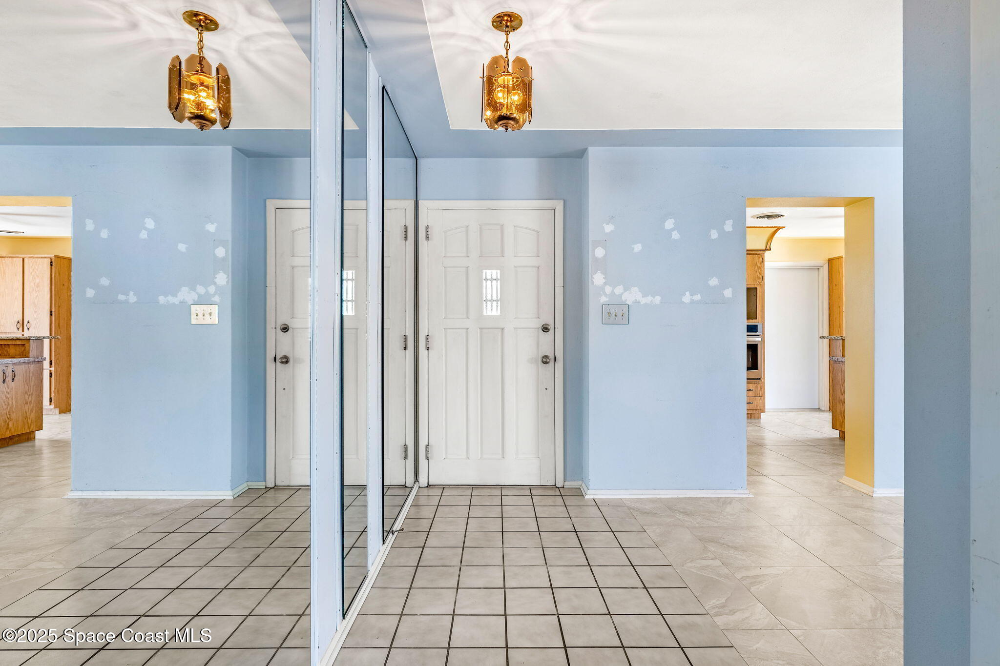 272 Bahama Boulevard Cocoa Beach, FL 32931 - Photo 8 of 63 a view of a hallway view with wooden floor and windows