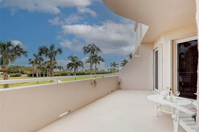 a building outdoor space with patio furniture and potted plants