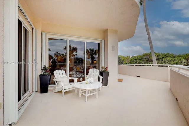 an outdoor sitting area with a bench