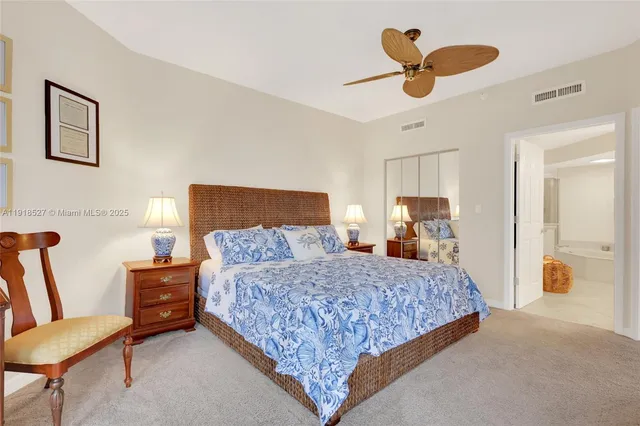 a bedroom with a bed and a walk in closet