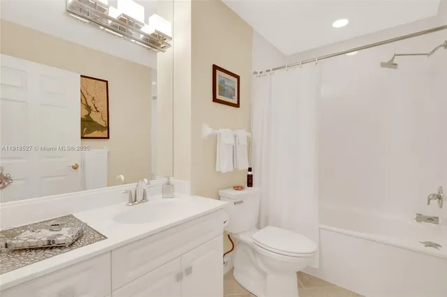 a view of a swimming pool with a yard and potted plants