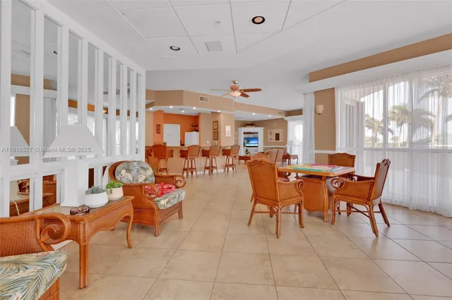 a view of a balcony with wooden floor and fence