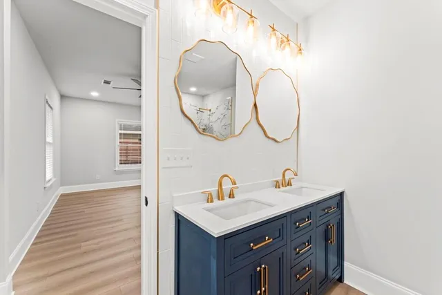 a bathroom with a sink and a mirror