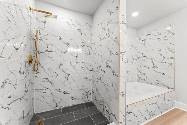 a bathroom with a toilet a sink and a mirror