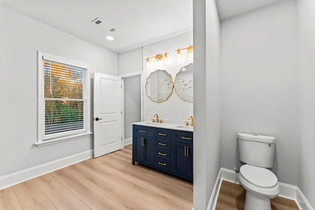 a view of entryway with wooden floor and stairs