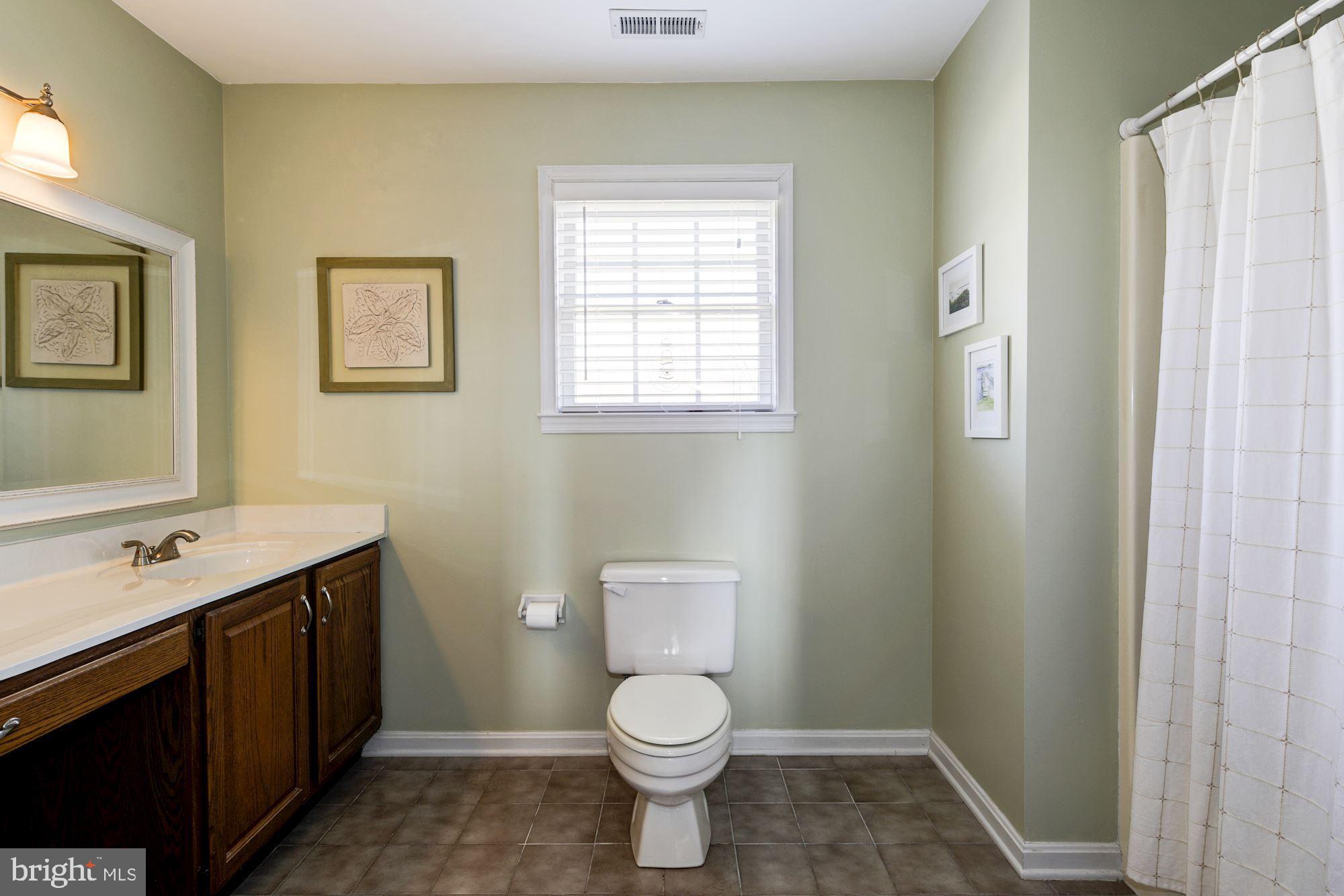 2005 Kingsforth Drive Fallston, MD 21047 - Photo 40 of 53 a bathroom with a toilet a sink and a window