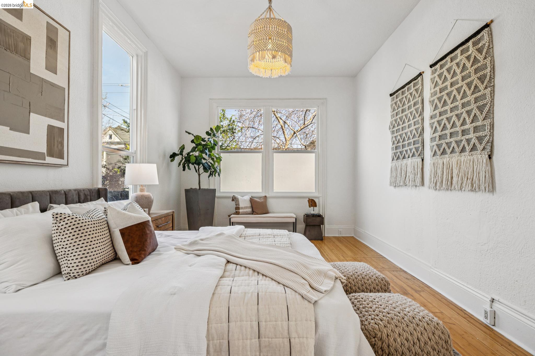 1655 12th Street Oakland, CA 94607 - Photo 12 of 51 a bedroom with a bed and window