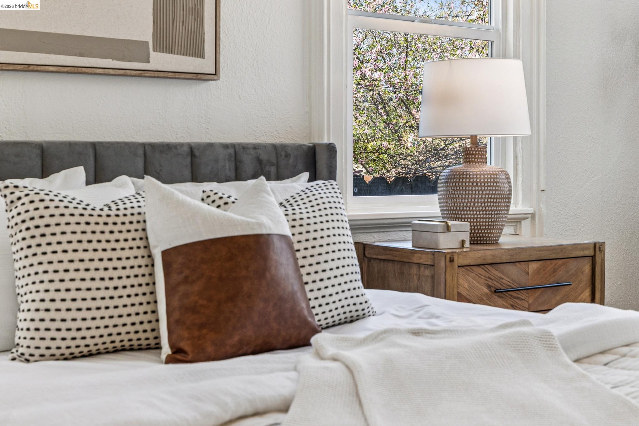 1655 12th Street Oakland, CA 94607 - Photo 13 of 51 a bedroom with a bed and wooden floor