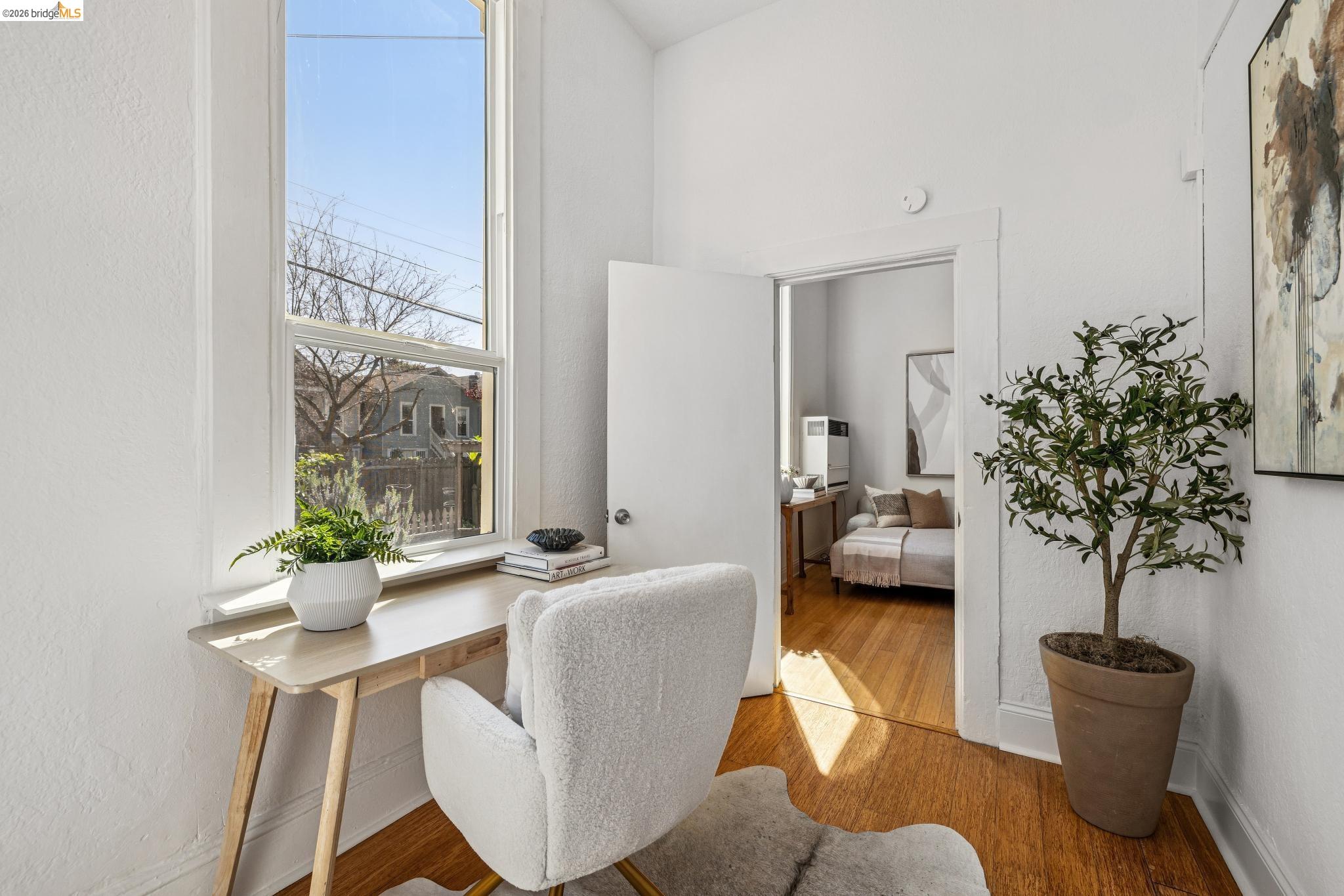 1655 12th Street Oakland, CA 94607 - Photo 17 of 51 a living room with furniture and a potted plant