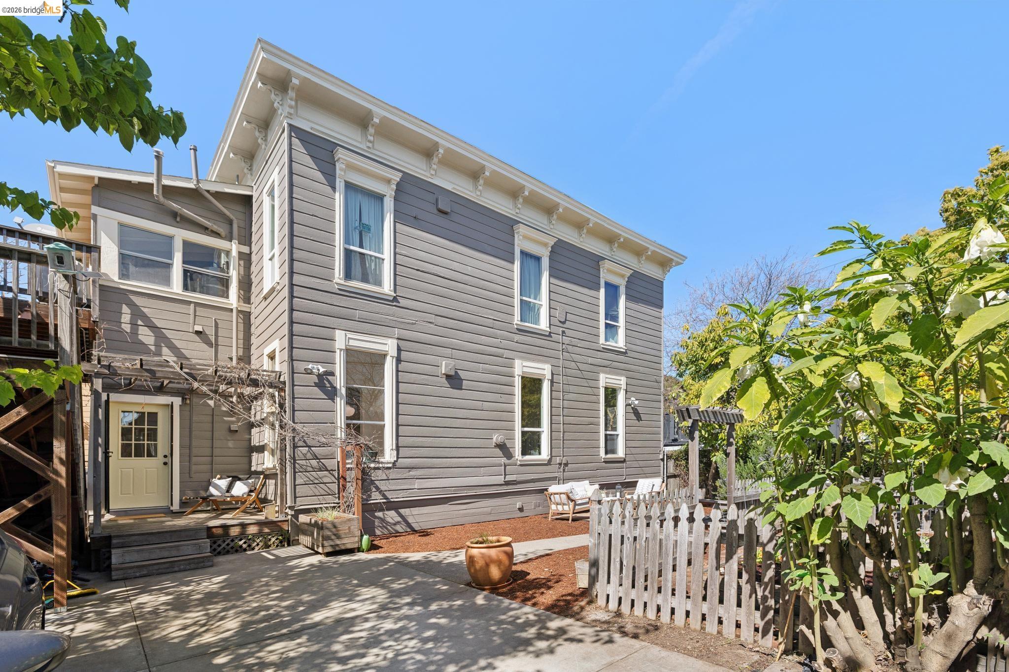 1655 12th Street Oakland, CA 94607 - Photo 26 of 51 a front view of a house with a yard
