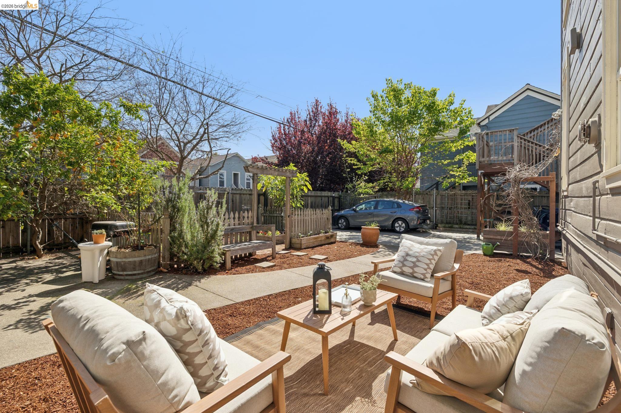 1655 12th Street Oakland, CA 94607 - Photo 28 of 51 a view of a patio with couches and chairs with wooden floor