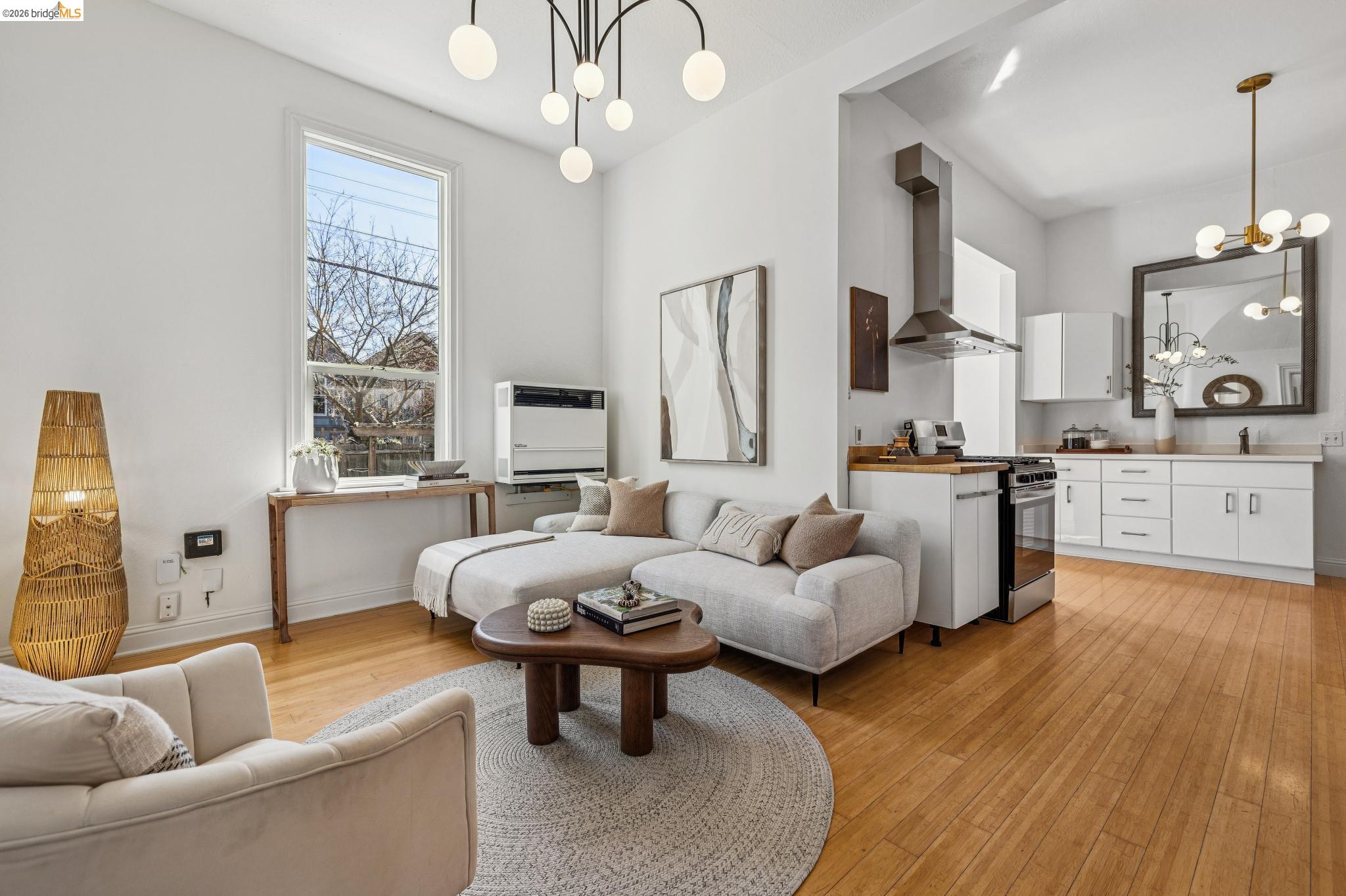 1655 12th Street Oakland, CA 94607 - Photo 3 of 51 a living room with furniture and a large window