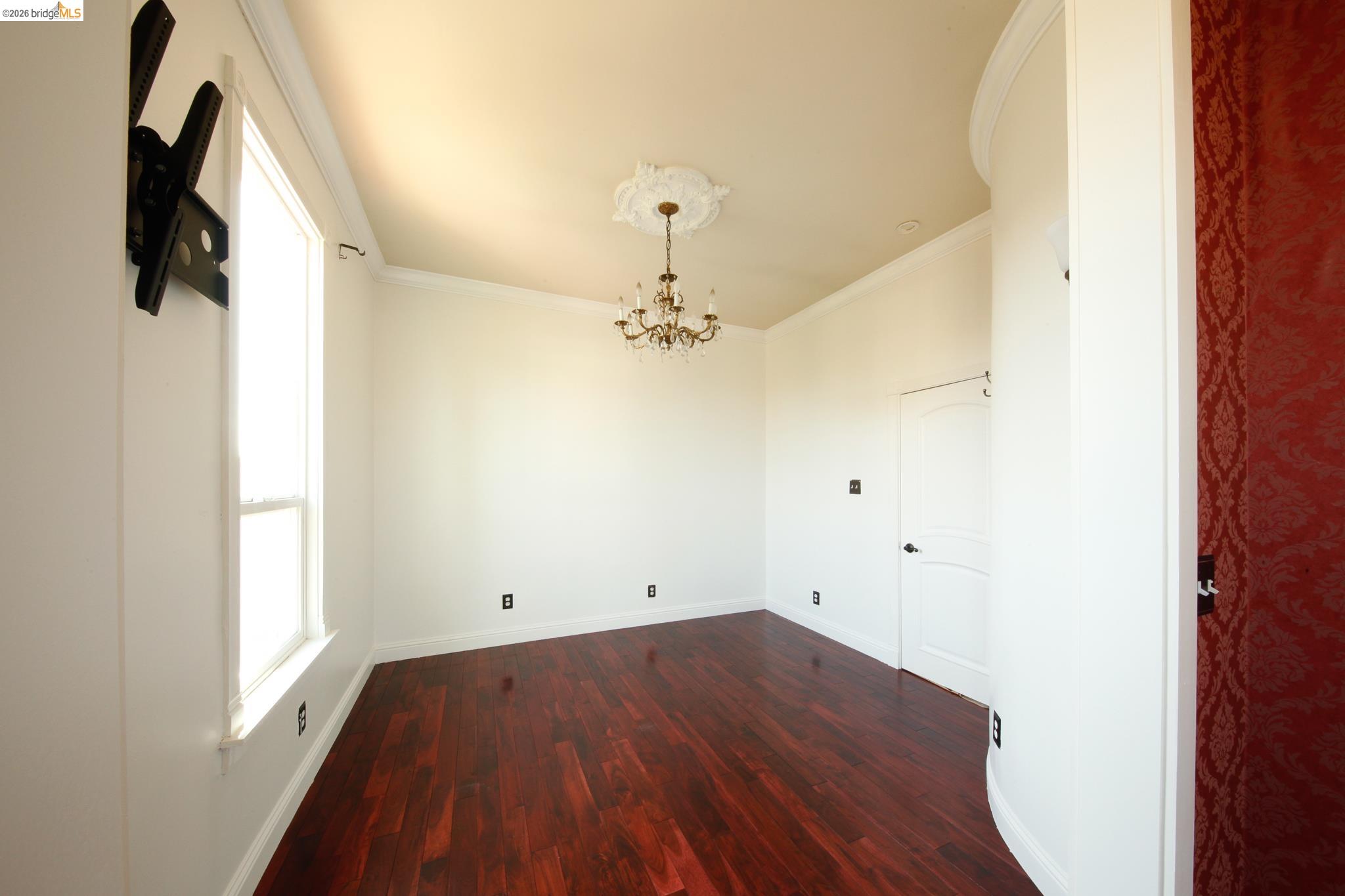1655 12th Street Oakland, CA 94607 - Photo 37 of 51 wooden floor in an empty room with a window