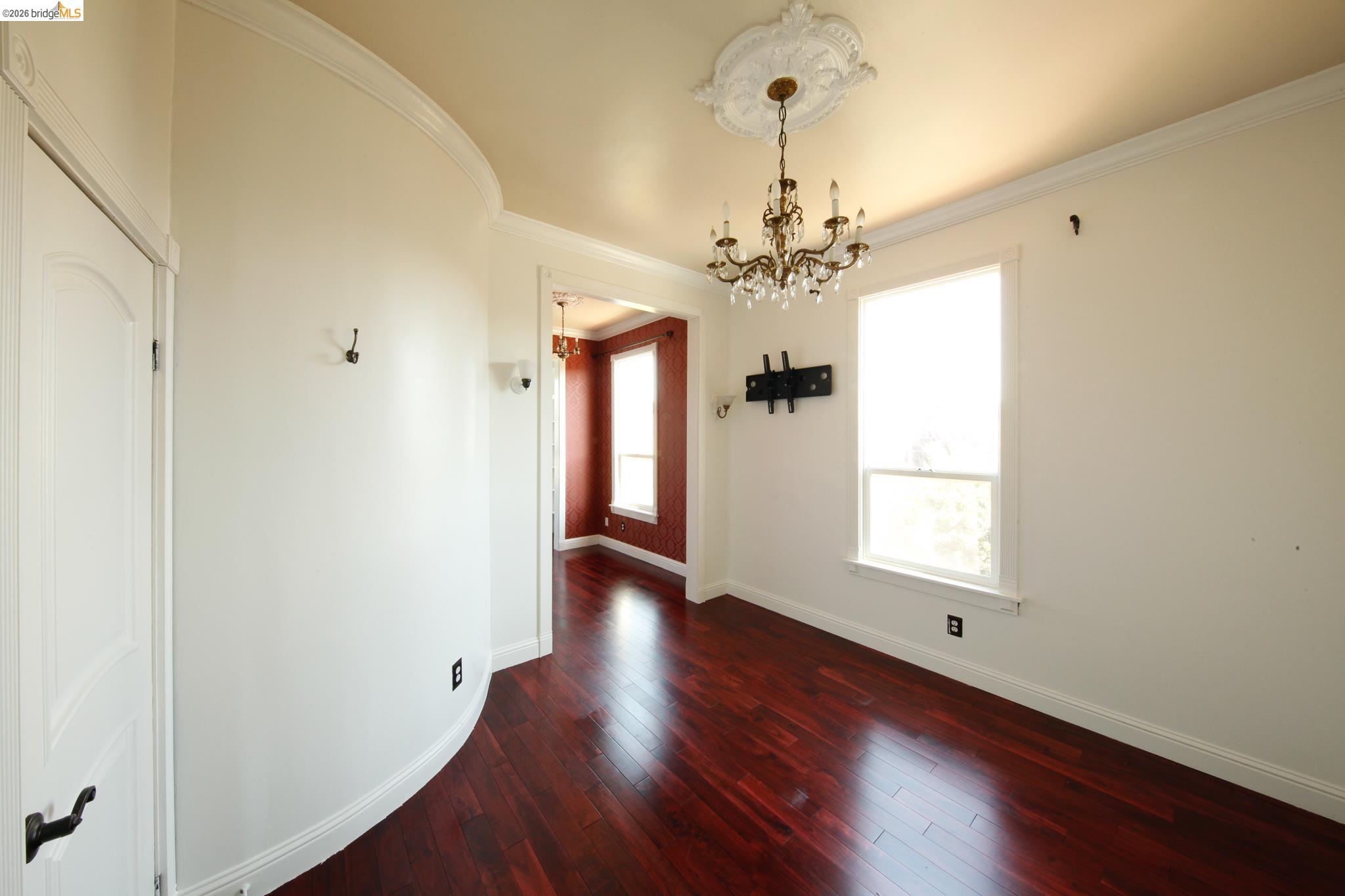 1655 12th Street Oakland, CA 94607 - Photo 39 of 51 a view of an empty room with a window and wooden floor