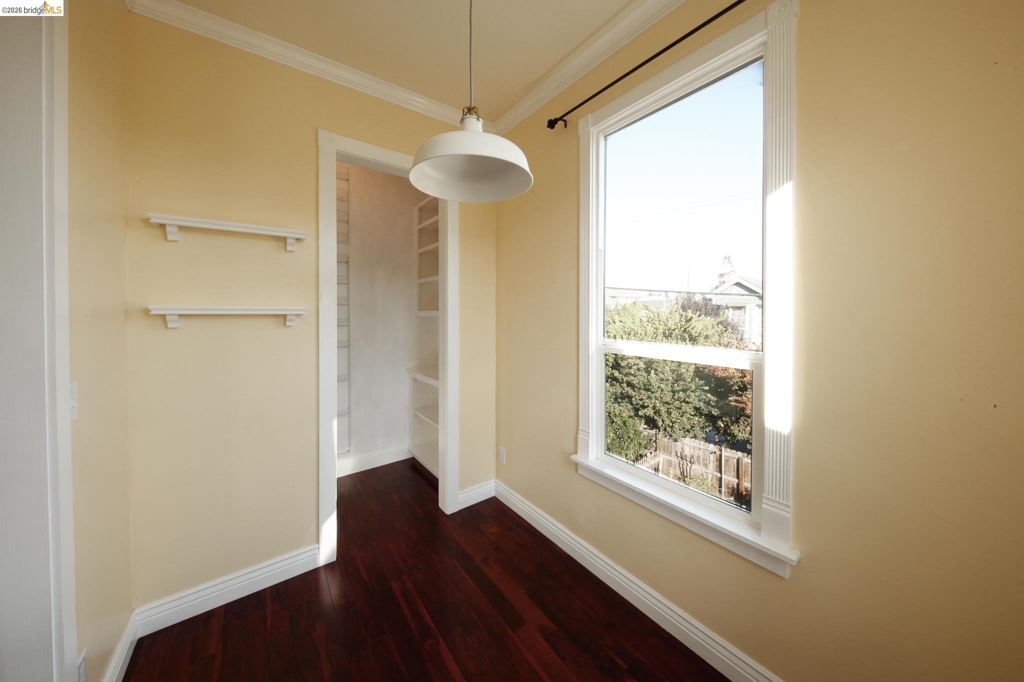 1655 12th Street Oakland, CA 94607 - Photo 41 of 51 a view of a hallway with wooden floor and a chandelier