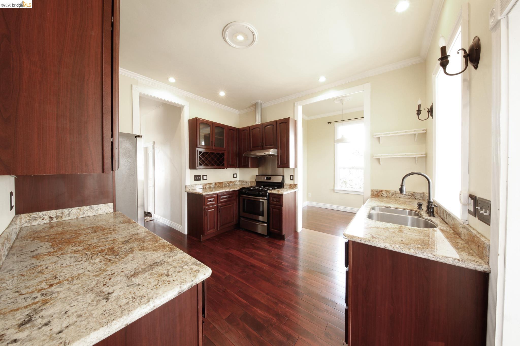 1655 12th Street Oakland, CA 94607 - Photo 43 of 51 a kitchen with stainless steel appliances granite countertop a sink stove and refrigerator