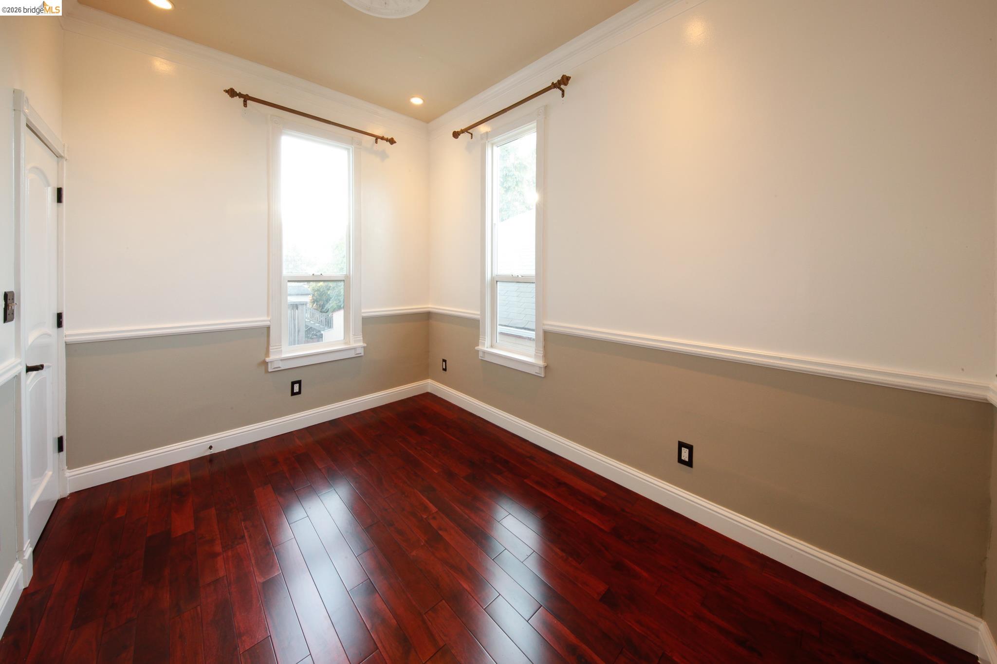 1655 12th Street Oakland, CA 94607 - Photo 46 of 51 an empty room with wooden floor and windows