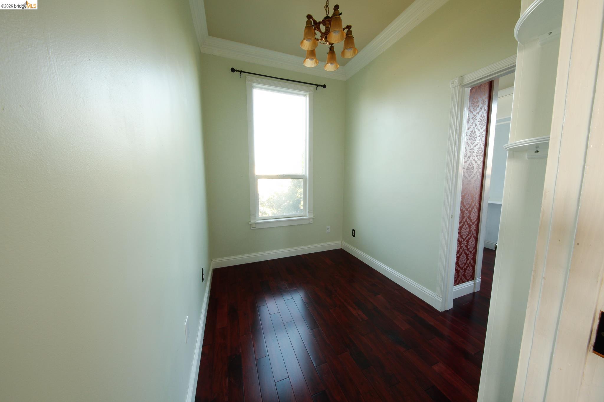 1655 12th Street Oakland, CA 94607 - Photo 47 of 51 an empty room with wooden floor and windows
