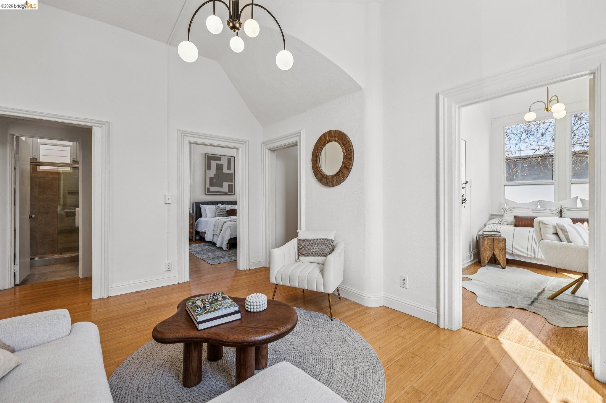 1655 12th Street Oakland, CA 94607 - Photo 6 of 51 a living room with furniture a mirror and a large window