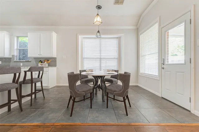 a dining room with furniture window and outside view