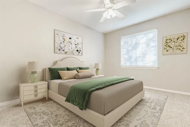 a bedroom with a large bed and a window