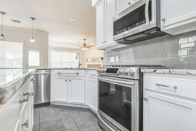 a kitchen with a stove microwave and a sink