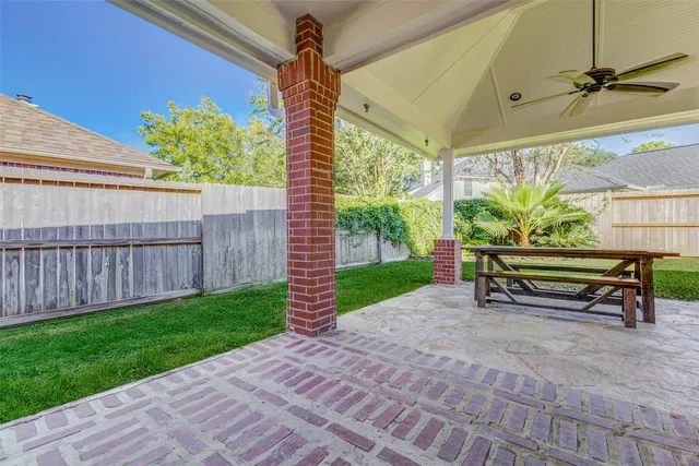 a view of a backyard with a patio