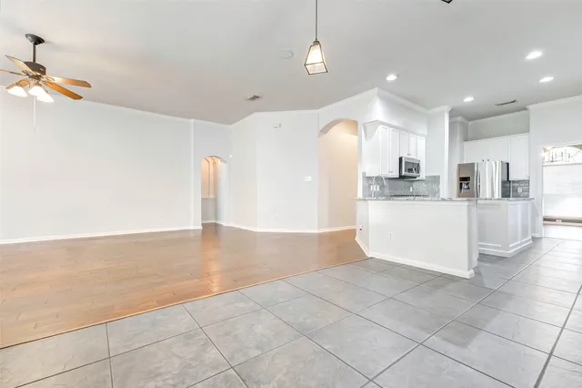a large kitchen with cabinets and a counter top space