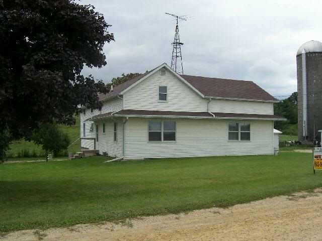 14895 East Kent School Road Kent, IL 61044 - Photo 1 of 3 a front view of a house with a garden