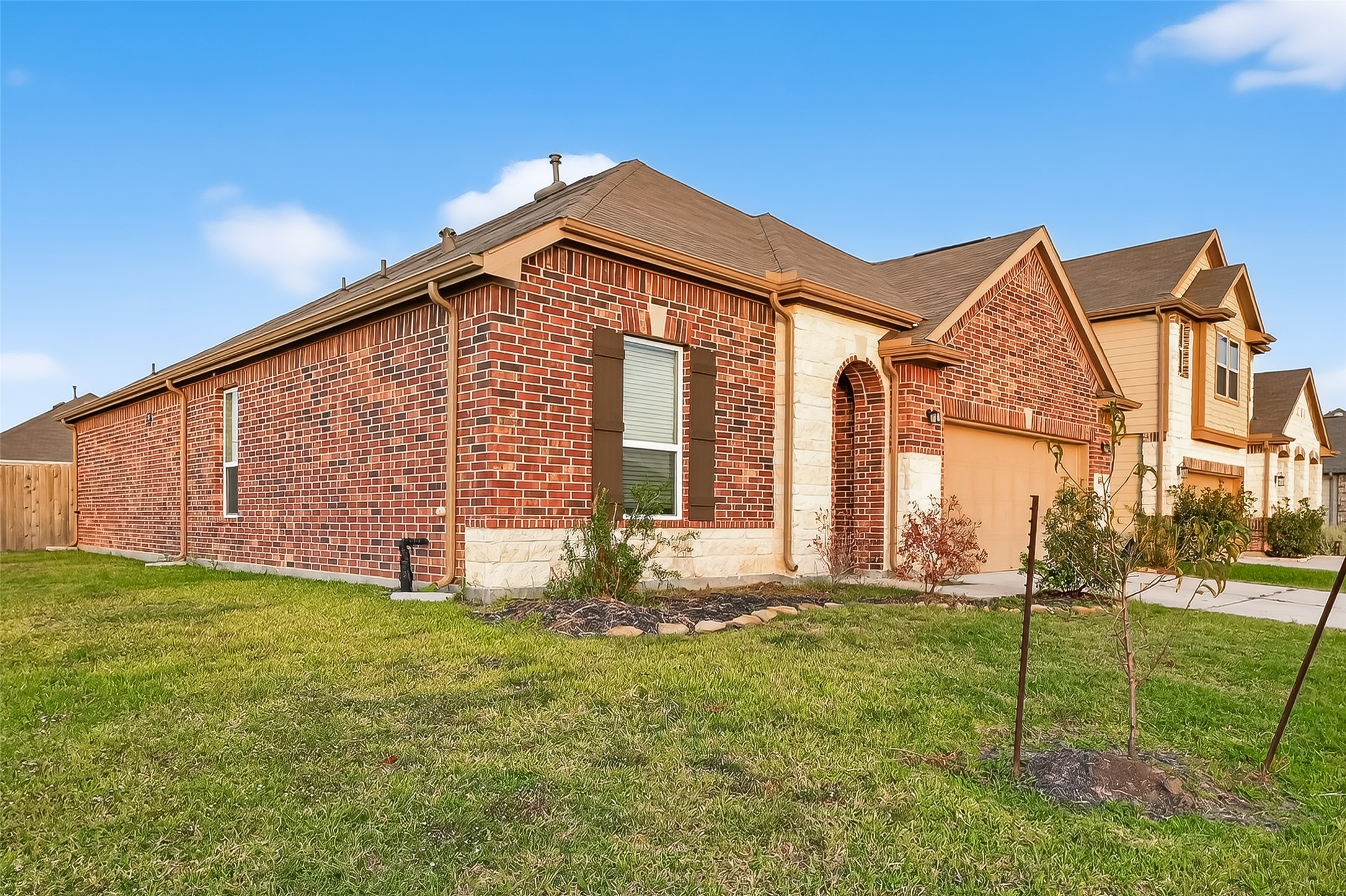 5907 Osprey Drive Rosenberg, TX 77469 - Photo 3 of 36 a front view of a house with a yard and trees