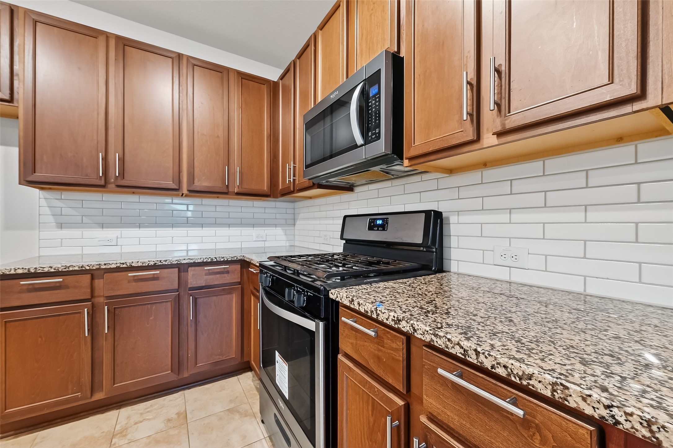 5907 Osprey Drive Rosenberg, TX 77469 - Photo 8 of 36 a kitchen with granite countertop cabinets stainless steel appliances and a sink