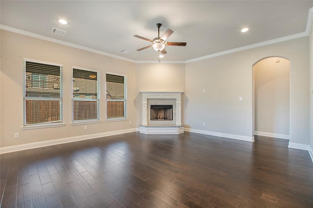 2811 Diamond Ridge Drive Arlington, TX 76001 - Photo 11 of 35 a view of an empty room with wooden floor and a window