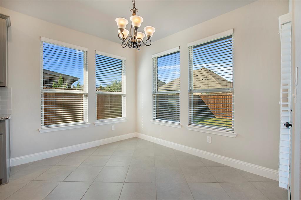 2811 Diamond Ridge Drive Arlington, TX 76001 - Photo 16 of 35 a view of an empty room with a window and chandelier