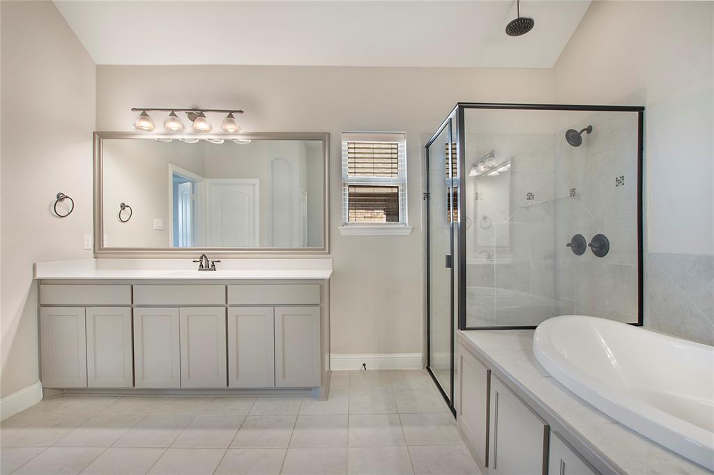 2811 Diamond Ridge Drive Arlington, TX 76001 - Photo 27 of 35 a bathroom with a double vanity sink mirror and shower