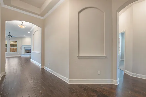 a view of an entryway with wooden floor