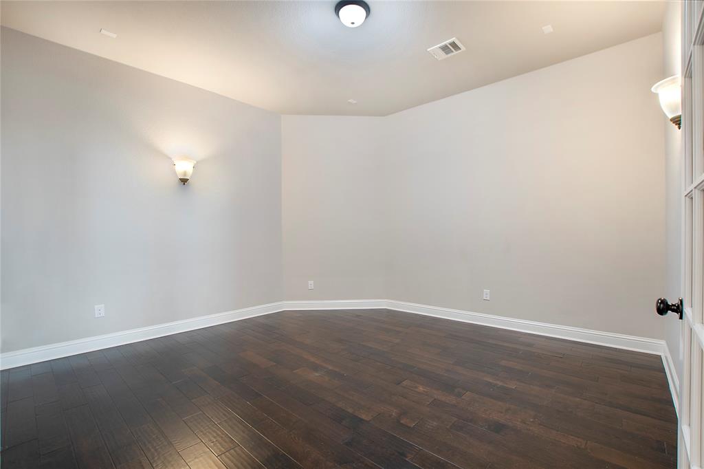 2811 Diamond Ridge Drive Arlington, TX 76001 - Photo 9 of 35 a view of an empty room with wooden floor