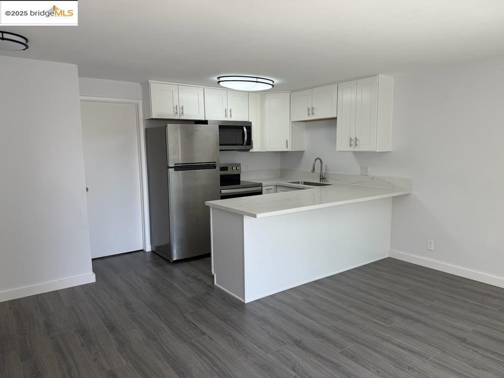 4057 Brant Street, Unit 8 San Diego, CA 92103 - Photo 3 of 17 a kitchen with a refrigerator sink and cabinets
