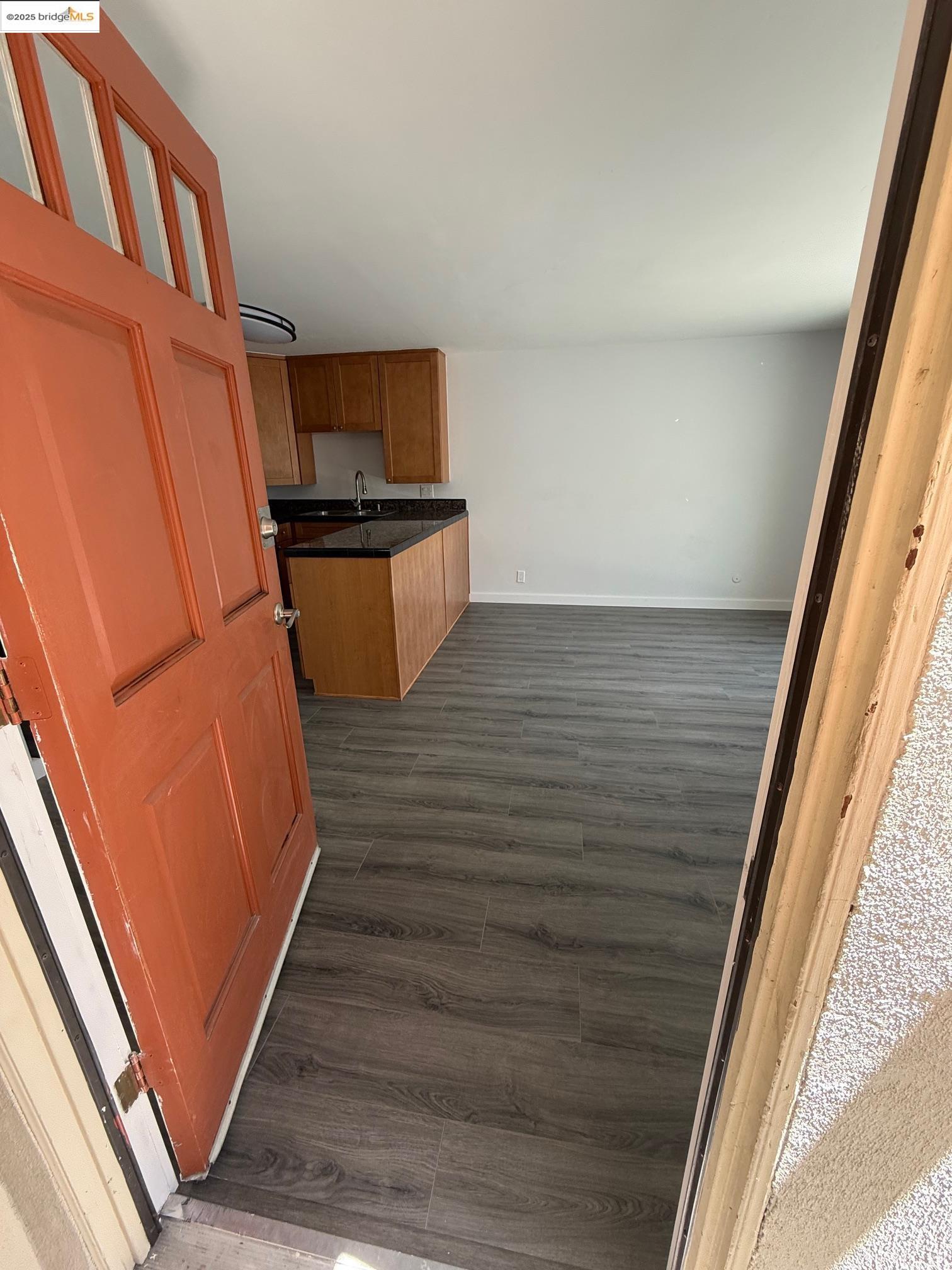 4057 Brant Street, Unit 8 San Diego, CA 92103 - Photo 7 of 17 a view of an empty room and wooden floor