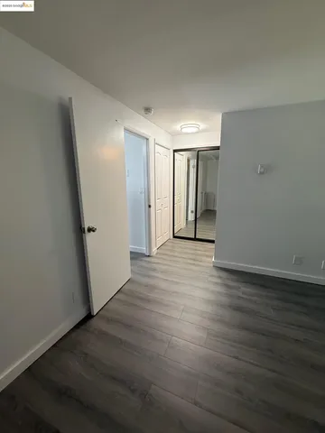 a view of hallway with wooden floor