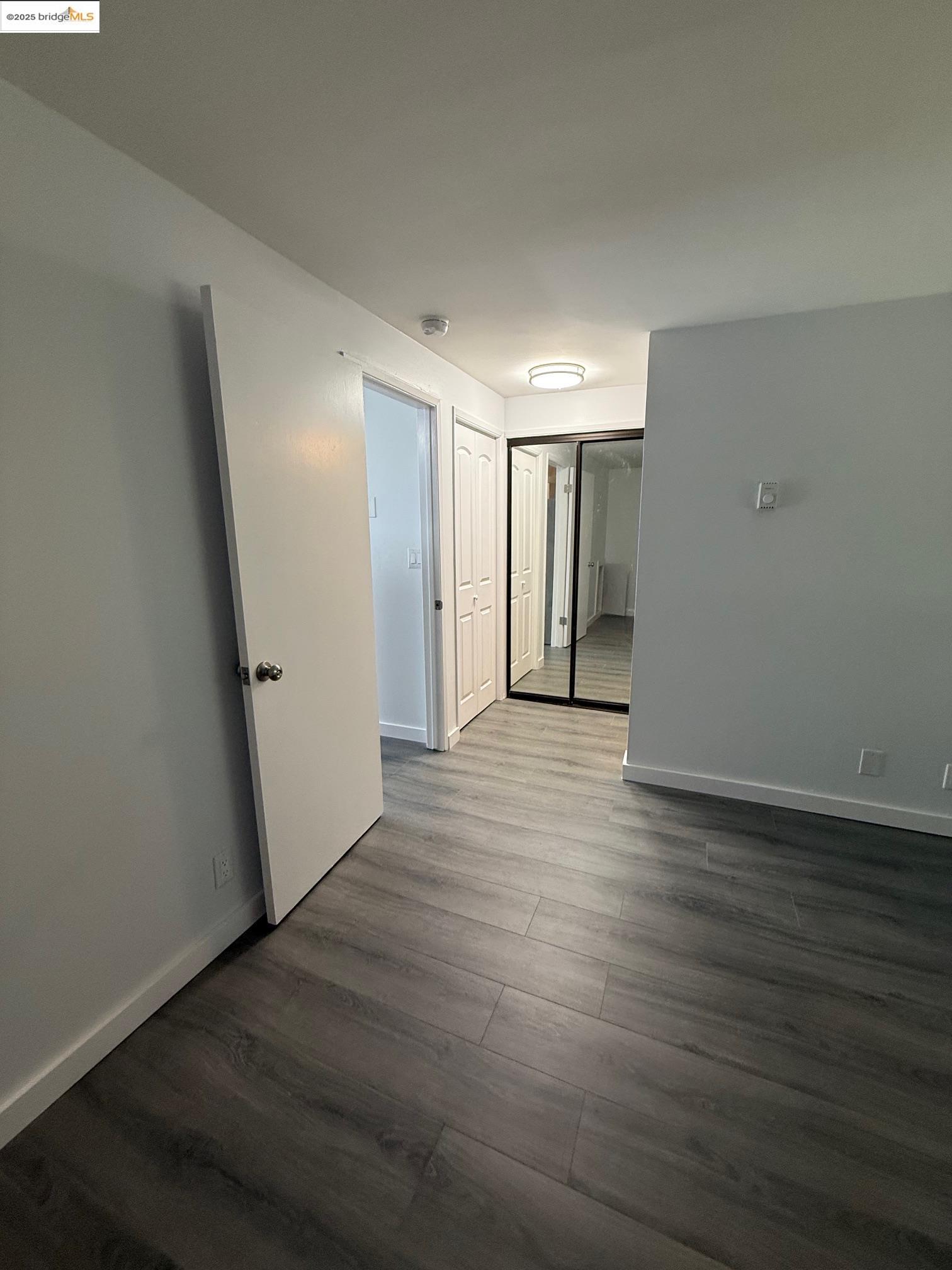 4057 Brant Street, Unit 8 San Diego, CA 92103 - Photo 9 of 17 a view of hallway with wooden floor